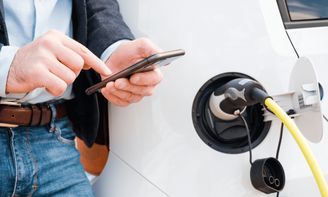 Man using phone to manage ev charging session